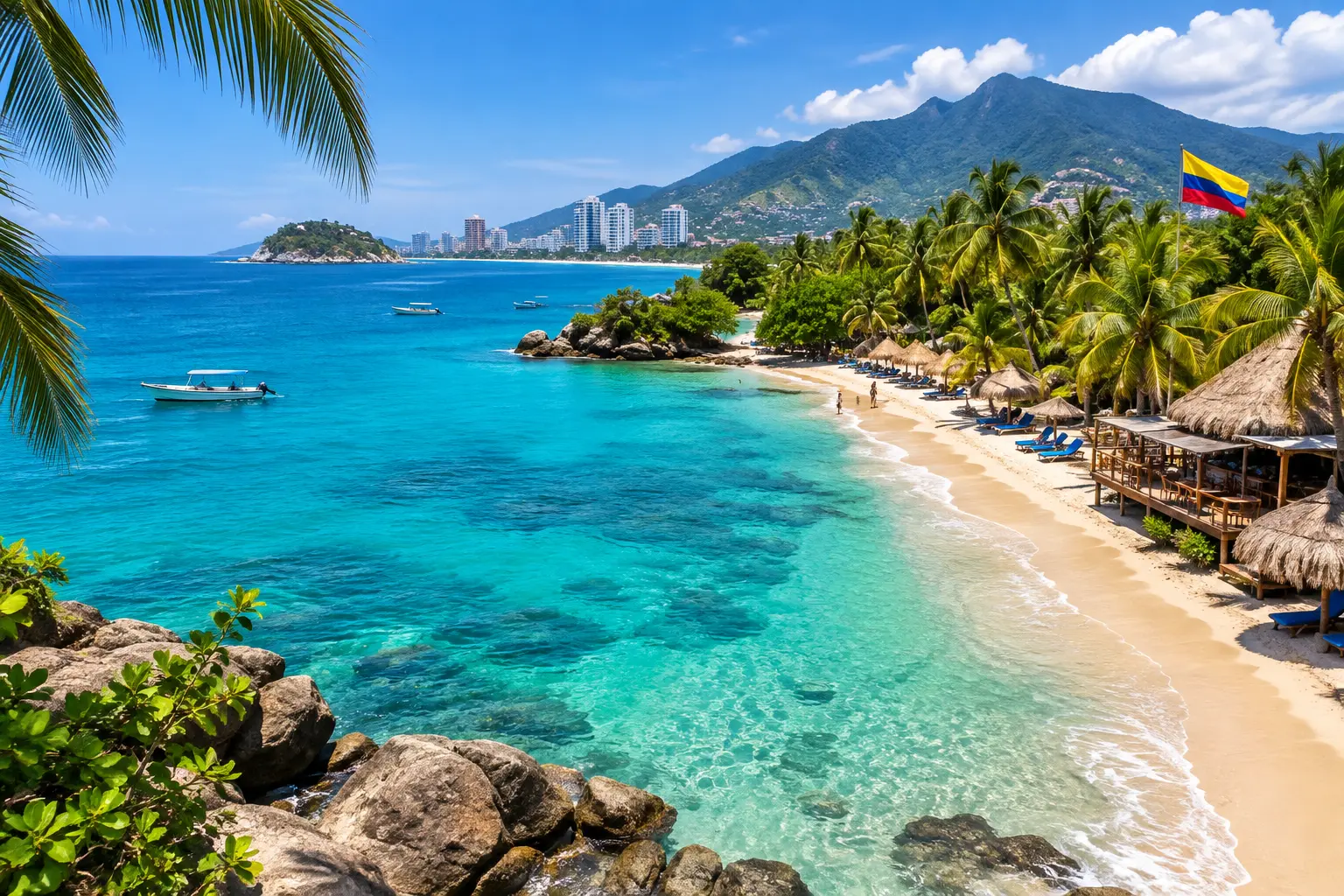 Tropical beach in Colombia with turquoise water, palm trees and the Colombian flag